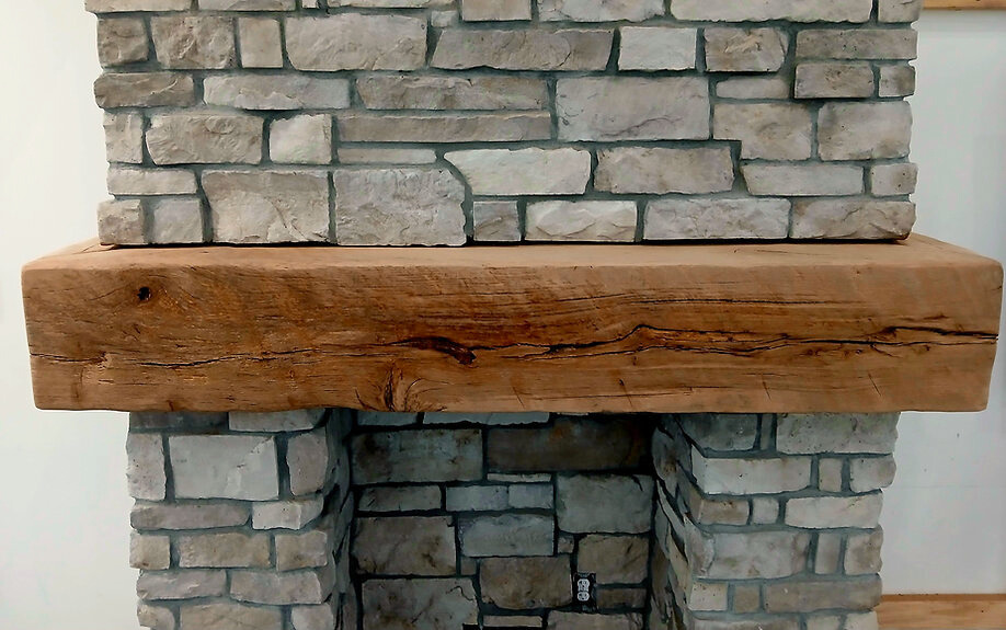 Modern rustic mantel with straight edges and white oak wood